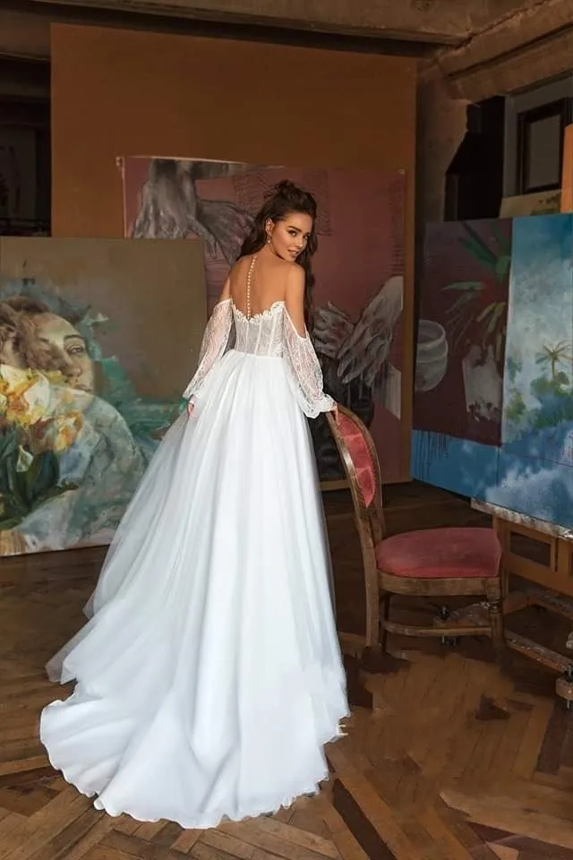 Elegant Bohemian Lace Beach Wedding Dress With Long Sleeves Off The Shoulder And Flowing Skirt