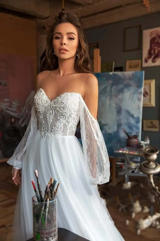 Elegant Bohemian Lace Beach Wedding Dress With Long Sleeves Off The Shoulder And Flowing Skirt