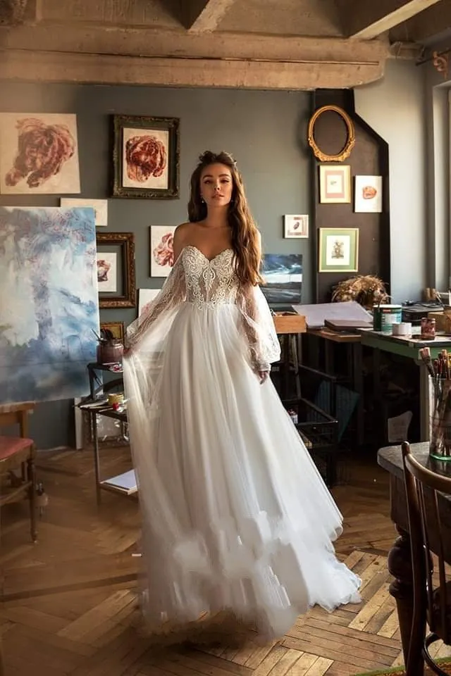 Elegant Bohemian Lace Beach Wedding Dress With Long Sleeves Off The Shoulder And Flowing Skirt
