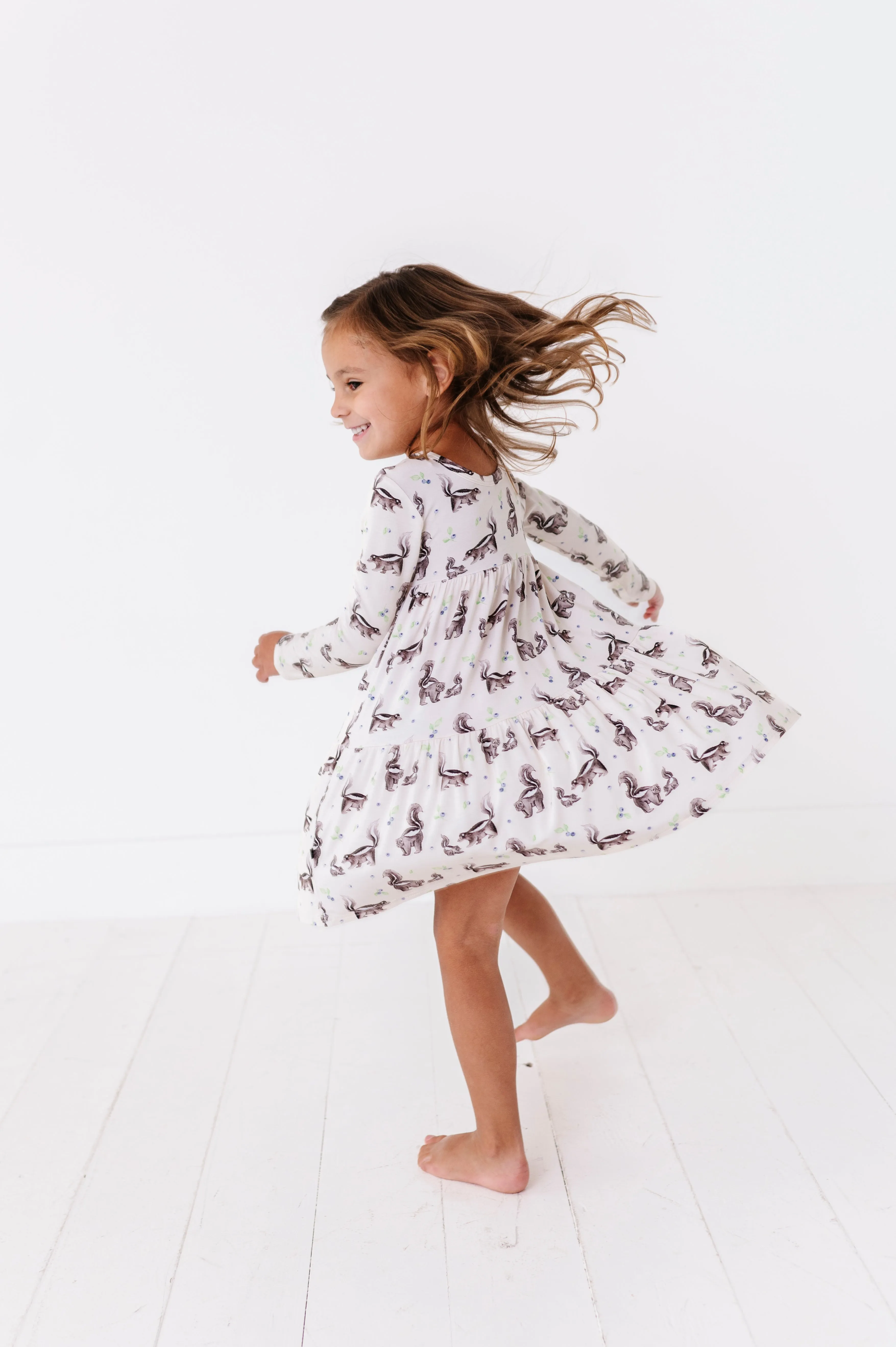 The Sleepy Sloth Berry Stinky Skunk Print Girls Tiered Long Sleeve Twirlie Dress